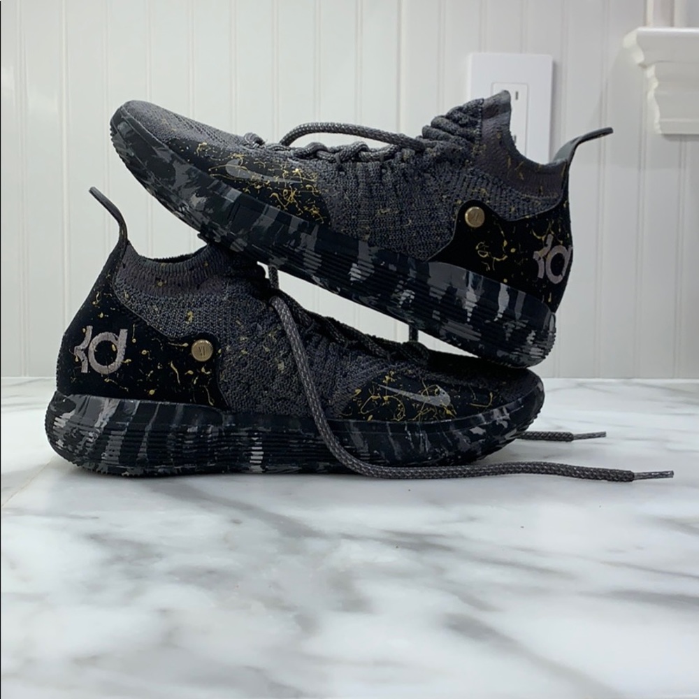 Nike KD basketball shoes with gold splatter paint